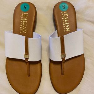 Size 8, brown and white strapped sandals.